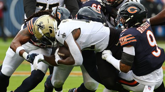 Oct 19, 2025; Chicago, Illinois, USA; Chicago Bears safety Jaquan Brisker (9) tackles New Orleans Saints running back Alvin Kamara (41) during the first quarter at Soldier Field. Oct 19, 2025; Chicago, Illinois, USA; Chicago Bears safety Jaquan Brisker (9) tackles New Orleans Saints running back Alvin Kamara (41) during the first quarter at Soldier Field.