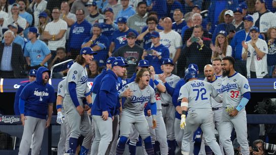 Los Angeles Dodgers second baseman Miguel Rojas (72) reacts after hitting a home run against the Toronto Blue Jays in the ninth inning for game seven of the 2025 MLB World Series at Rogers Centre. Los Angeles Dodgers second baseman Miguel Rojas (72) reacts after hitting a home run against the Toronto Blue Jays in the ninth inning for game seven of the 2025 MLB World Series at Rogers Centre.