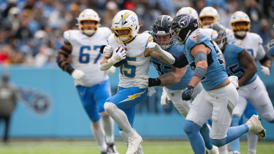 Nov 2, 2025; Nashville, Tennessee, USA; Los Angeles Chargers wide receiver Ladd McConkey (15) drags Tennessee Titans safety Amani Hooker (37) during the first half at Nissan Stadium. Nov 2, 2025; Nashville, Tennessee, USA; Los Angeles Chargers wide receiver Ladd McConkey (15) drags Tennessee Titans safety Amani Hooker (37) during the first half at Nissan Stadium.