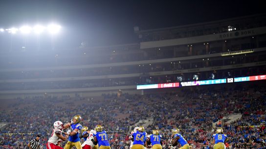 Nov 8, 2025; Pasadena, California, USA; UCLA Bruins running back Jaivian Thomas (21) runs the ball against the Nebraska Cornhuskers during the second half at the Rose Bowl. Nov 8, 2025; Pasadena, California, USA; UCLA Bruins running back Jaivian Thomas (21) runs the ball against the Nebraska Cornhuskers during the second half at the Rose Bowl.
