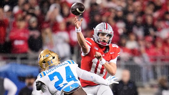 Ohio State Buckeyes quarterback Julian Sayin (10) throws over UCLA Bruins defensive lineman Cole Cogshell (24) during the NCAA football game at Ohio Stadium in Columbus on Nov. 15, 2025 Ohio State Buckeyes quarterback Julian Sayin (10) throws over UCLA Bruins defensive lineman Cole Cogshell (24) during the NCAA football game at Ohio Stadium in Columbus on Nov. 15, 2025
