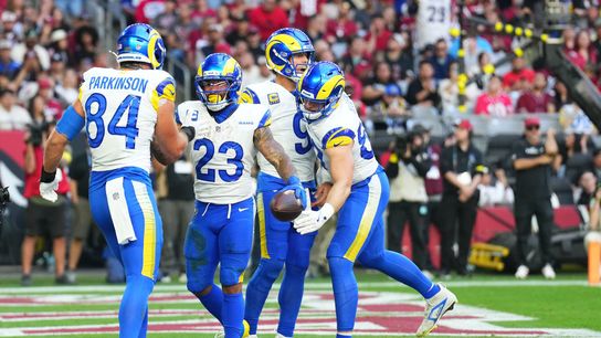 Dec 7, 2025; Glendale, Arizona, USA; Los Angeles Rams running back Kyren Williams (23) reacts after scoring a touchdown against the Arizona Cardinals during the first half at State Farm Stadium. 