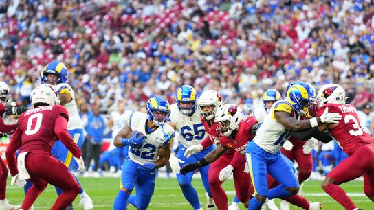 Dec 7, 2025; Glendale, Arizona, USA; Los Angeles Rams running back Blake Corum (22) rushes the ball against the Arizona Cardinals during the second half at State Farm Stadium.