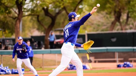 Los Angeles Dodgers pitcher Roki Sasaki (11) on the mound during Los Angeles Dodger workouts at Camelback Ranch in Glendale, Arizona. Los Angeles Dodgers pitcher Roki Sasaki (11) on the mound during Los Angeles Dodger workouts at Camelback Ranch in Glendale, Arizona.