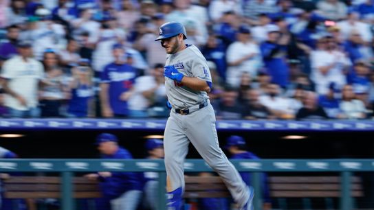 Los Angeles Dodgers third baseman Max Muncy (13) rounds the bases on a solo home run in the second inning against the Colorado Rockies at Coors Field. Los Angeles Dodgers third baseman Max Muncy (13) rounds the bases on a solo home run in the second inning against the Colorado Rockies at Coors Field.
