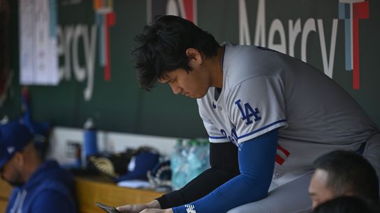 Los Angeles Dodgers designated hitter Shohei Ohtani (17) looks at a tablet during a game against the St. Louis Cardinals in the first inning at Busch Stadium. Los Angeles Dodgers designated hitter Shohei Ohtani (17) looks at a tablet during a game against the St. Louis Cardinals in the first inning at Busch Stadium.