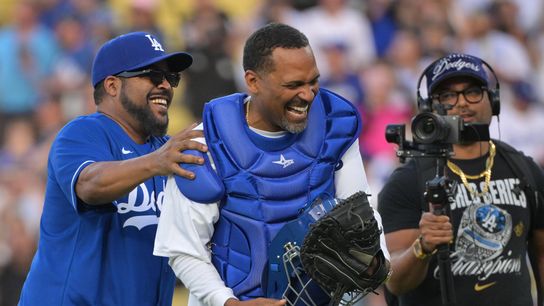 Rapper, actor and producer Ice Cube reacts with comedian and actor Mike Epps after throwing out the ceremonial first pitch before a game between the San Francisco Giants and Los Angeles Dodgers at Dod... Rapper, actor and producer Ice Cube reacts with comedian and actor Mike Epps after throwing out the ceremonial first pitch before a game between the San Francisco Giants and Los Angeles Dodgers at Dod...