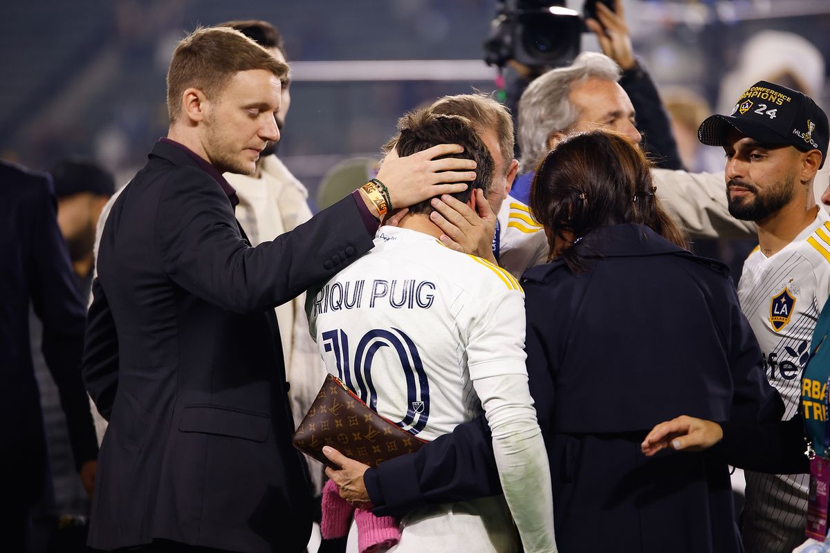 LA Galaxy Midfielder Riqui Puig (10) being consoled by his parents after discussing injury after match against Seattle Sounders FC on Saturday, November 30, 2024 in Carson, CA. LA Galaxy Midfielder Riqui Puig (10) being consoled by his parents after discussing injury after match against Seattle Sounders FC on Saturday, November 30, 2024 in Carson, CA.