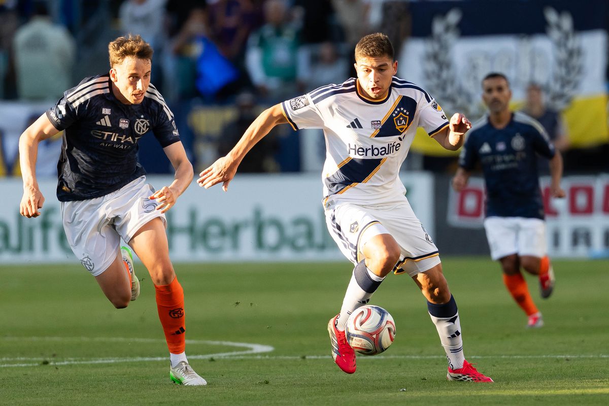 Los Angeles Galaxy midfielder Lucas Sanabria (8) fighting off his opponent during an MLS game, Sunday February 22nd, 2026 in Carson, Calif