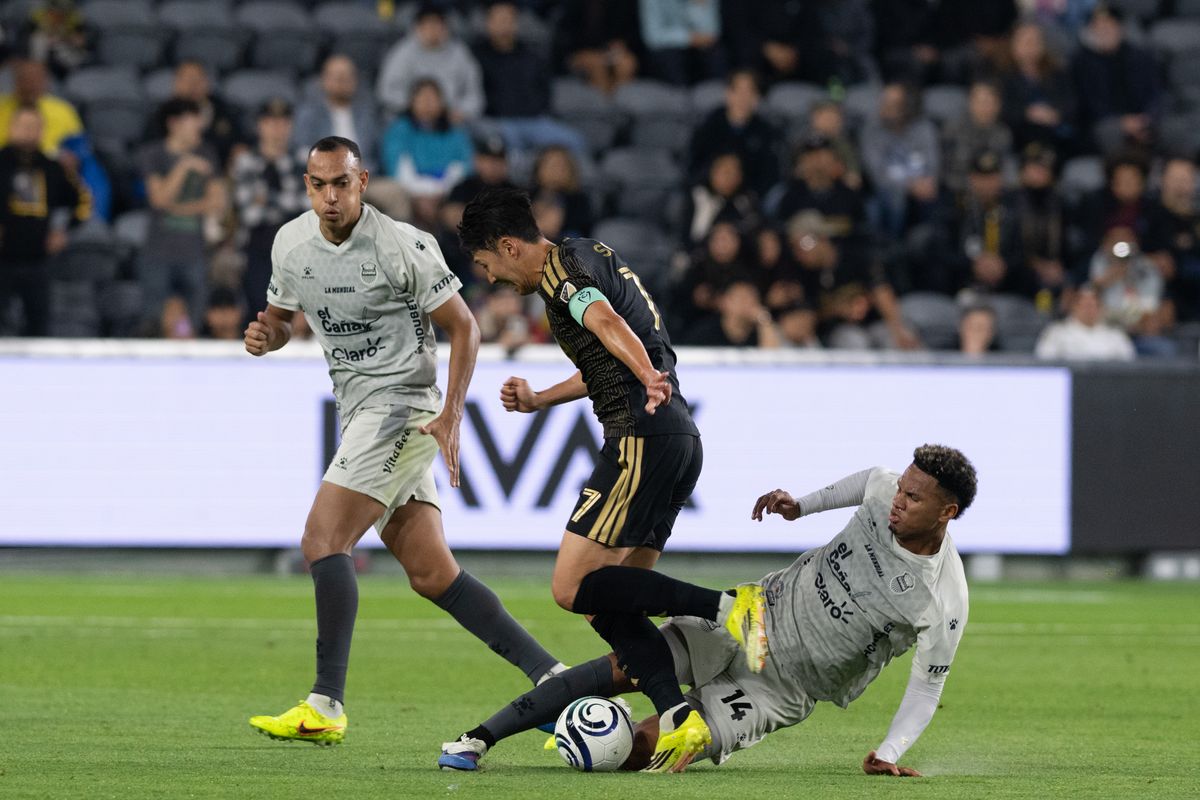 LAFC forward Son Heung-Min (7) dribbles the ball against Real Espana defenders during a CONCACAF game between LAFC and Real Espana on Friday, February 24,2026 at BMO Stadium in Los Angeles Calif LAFC forward Son Heung-Min (7) dribbles the ball against Real Espana defenders during a CONCACAF game between LAFC and Real Espana on Friday, February 24,2026 at BMO Stadium in Los Angeles Calif