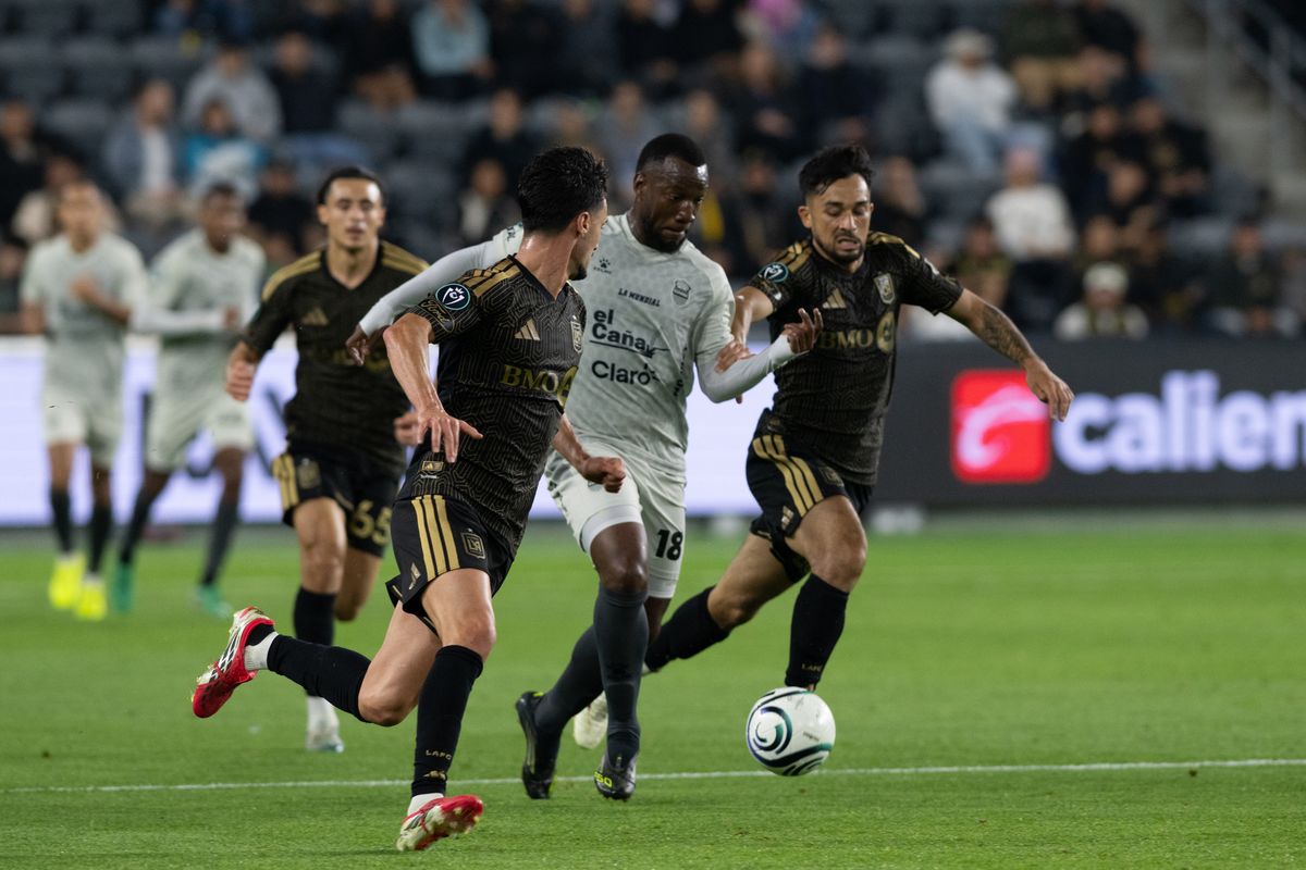 Real Espana midfielder Jhow Benavidez (10) gets tackled during a CONCACAF game between LAFC and Real Espana on Friday, February 24,2026 at BMO Stadium in Los Angeles Calif Real Espana midfielder Jhow Benavidez (10) gets tackled during a CONCACAF game between LAFC and Real Espana on Friday, February 24,2026 at BMO Stadium in Los Angeles Calif