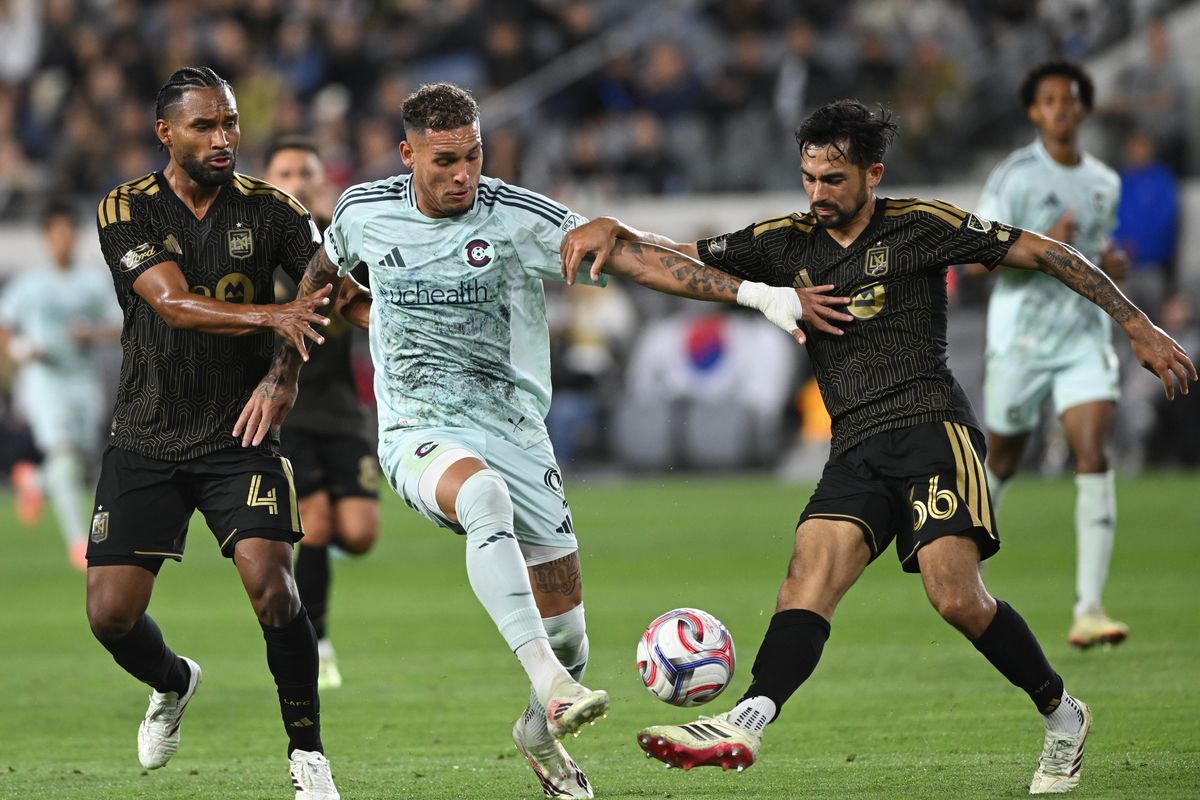 Colorado Rapids forward Rafael Navarro (9) battles for control against LAFC defenders Eddie Segura (4) and Mathieu Choinière (66) during an MLS game between LAFC and Colorado Rapids on Wednesday, April 22, 2026 at BMO Stadium In Los Angeles Calif at BMO Stadium in Los Angeles Calif Colorado Rapids forward Rafael Navarro (9) battles for control against LAFC defenders Eddie Segura (4) and Mathieu Choinière (66) during an MLS game between LAFC and Colorado Rapids on Wednesday, April 22, 2026 at BMO Stadium In Los Angeles Calif at BMO Stadium in Los Angeles Calif