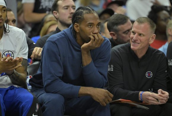 Apr 21, 2024; Los Angeles, California, USA; Los Angeles Clippers forward Kawhi Leonard (2) looks on from the bench during game one of the first round for the 2024 NBA playoffs against the Dallas Mavericks at Crypto.com Arena. Mandatory Credit: Jayne Kamin-Oncea-USA TODAY Sports